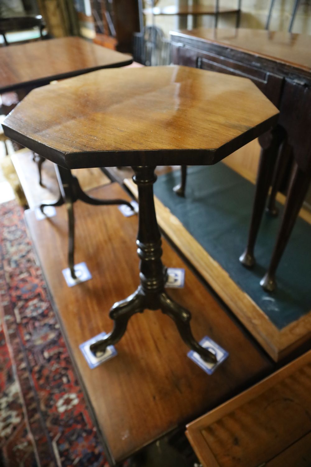 A Victorian octagonal rosewood tripod table, width 45cm, depth 74cm together with one other rectangular tripod table